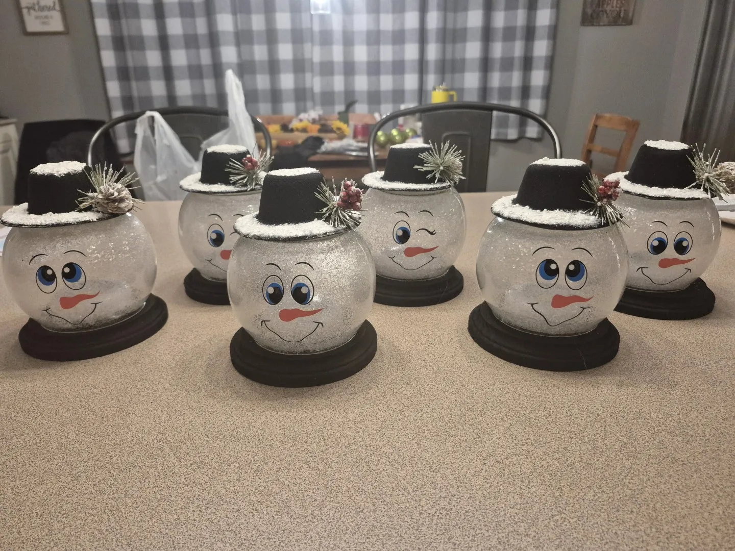 Some glass balls with faces and hats, designed to make them look like snowmen.